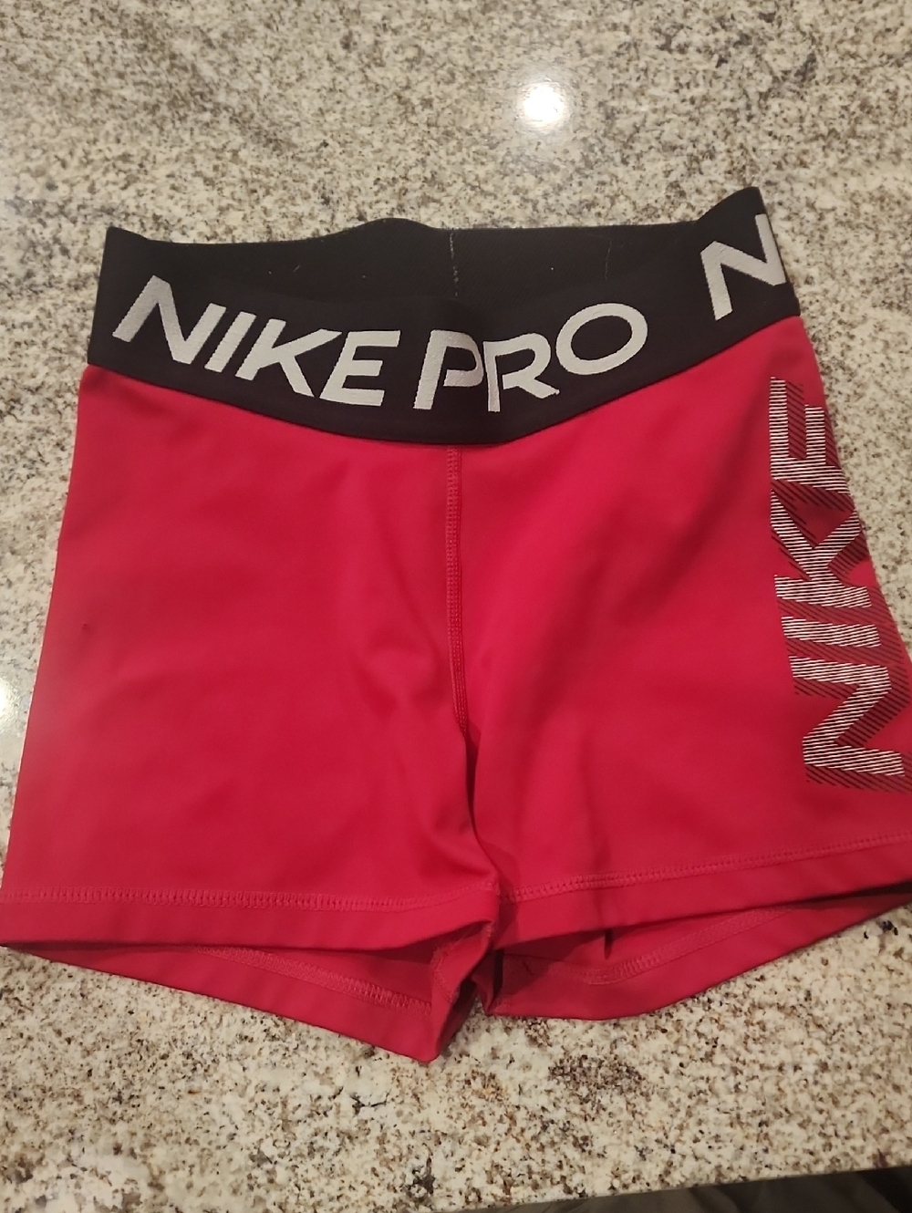 Nike Pro Women's Red Athletic Compression Shorts with Black Waistband